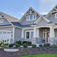 a house with gray siding and white trim