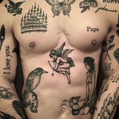 a man with many tattoos on his chest