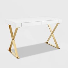 a white desk with gold x legs