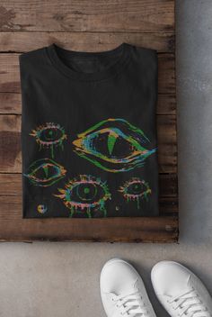 Thanks for stopping by! Grunge Glitch Eyes T-shirt Printed on a super soft, cotton tee Dispatched in 5 working days or sooner Unisex Free UK delivery Material: 100% ringspun cotton. Chest (to fit): S  34/36   M  38   L  40/42   XL  44/46   XXL  48/50 ECO-FRIENDLY Each garment is made to order, reducing extra material and energy that would be otherwise wasted We use DTG printing process which is easier on the environment than screen-printing Our ink is bright and also eco-friendly. Do not tumble Bleach Shirt, Harajuku Clothes, T Shirt Company, Black Balloons, Future Style, Goth Outfits, Pastel Goth, Quality T Shirts, Grunge Outfits