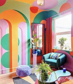 a living room with colorful walls and furniture