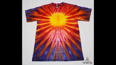 a tie - dyed t - shirt with an orange, yellow and blue design on it