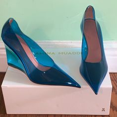 Brand New In Box Amina Muaddi Women's 'Ane' 95mm See-Through Pvc W/ Leather Trim Wedge Pumps Sizes: 9 B Us (39 Eu) Color/Details: Blue Colored Transparent Pvc 'Glass' Pumps With Leather Trim At The Heel, 3.8" Covered Wedge Heel, And Pointed Toe. Pvc Upper, Leather Lining Made In Italy! Original Retail Price: $1140 These Are A Beautiful Pair Of Shoes To Wear For A Night On The Town. Makes A Great Gift Too. Muaddi Shoes, Amina Muaddi Shoes, Denim On Denim, Amina Muaddi, Wedge Pumps, Womens Shoes Wedges, Shoe Game, Kylie Jenner, Wedge Heels