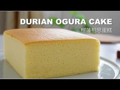 a piece of cake on a plate with the words, durian ogura cake