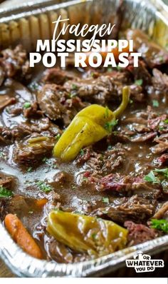 an image of a pot roast with meat and vegetables in it on a pan that is sitting on a table