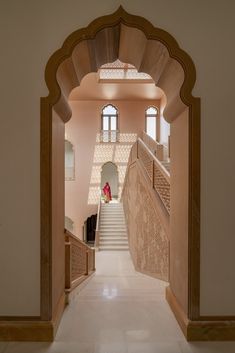 an archway leading up to the second floor