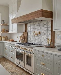 a kitchen with an oven, range and counter tops in it's center island