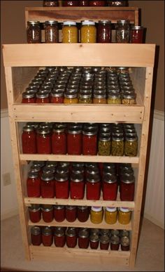 the shelves are filled with jars and spices