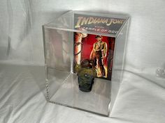 there is a display case with an indiana jones figure in the front and behind it