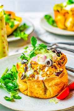 some food is sitting on a plate and ready to be eaten with other dishes in the background