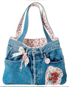 a denim purse with flowers and hearts on it