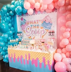 an ice cream stand with balloons and decorations