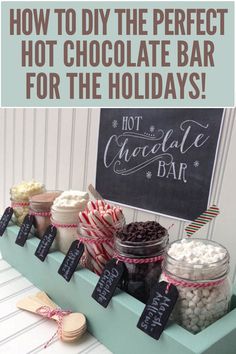 an assortment of hot chocolates and marshmallows in jars on a table