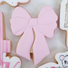 decorated cookies with pink bows and other decorations