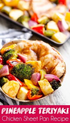 a bowl filled with chicken, broccoli and red onions next to a fork