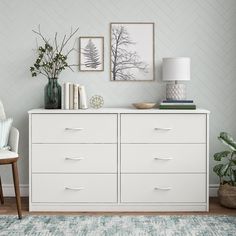 a white dresser topped with lots of drawers