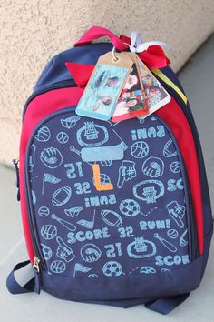 a blue and red backpack with pictures on it