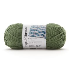 a ball of yarn that is green with blue and white designs on the side,