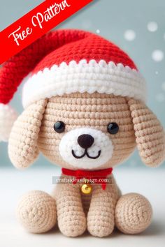 a crocheted dog with a santa hat on it's head sitting down