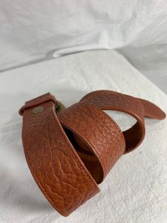 "You are looking at a genuine leather belt by Leatherock USA. Belt is size medium to large and measures 38\" long, 1\"2 wide, with 28\" 4 from the first perforation and 32\"4 at it's last perforation. Buckle measures 3\"1 wide X 2\"2 at it's highest. There are a few light scuffs with no tears. The condition of this belt is good with great detail, brass tone hardware with several stones and rhinestones. 100% genuine Leatherock made in USA. I want to stress that item is vintage which means it's no Brown Leather Belts With Antique Buckle, Brown Leather Belt With Antique Buckle, Adjustable Leather Belts For Everyday, Everyday Leather Adjustable Belt, Vintage Brown Leather Belt Buckle, Adjustable Vintage Brown Leather Belt Buckles, Leather Belts And Suspenders With Antique Buckle, Adjustable Leather Belts And Suspenders With Antique Buckle, Adjustable Leather Belt With Antique Buckle