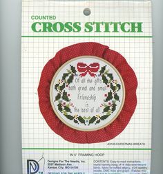 the cross stitch pattern is displayed in front of a package for it's purchase