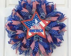 a patriotic wreath with god bless america written on it