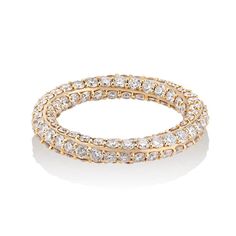 a gold ring with rows of diamonds