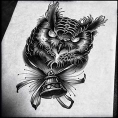 an owl with a bell tattoo design on it's chest and neck is shown