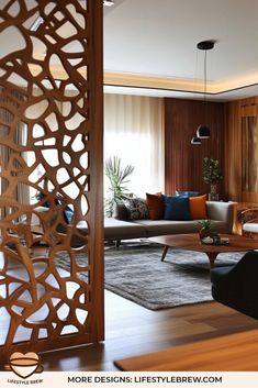 a living room filled with furniture next to a wooden wall and window covered in curtains