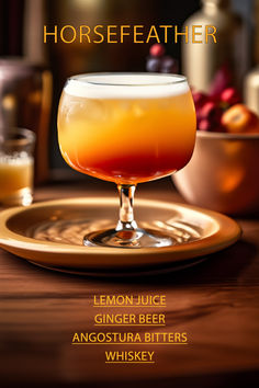 a glass filled with liquid sitting on top of a wooden table