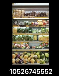 a display case filled with lots of different types of vegetables