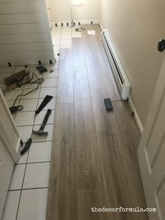 an empty room with tools on the floor