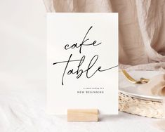 a card with the words coffee table written on it next to a plate and napkin