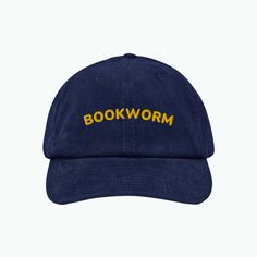 The Bookworm Corduroy Dad Cap Is A Testament To Literary Flair And Timeless Style. It's A Playful Homage To The Bibliophile Within. Whether You're Lost In The Pages Of A Novel Or On An Incredible Adventure, This Cap Is Your Literary Beacon. Step Out In Style And Let Your Passion For Books Shine As Brightly As The Letters On Your Cap. Details: 6-Panel Style, 100% Cotton Fabrication In Dark Blue "Bookworm" Embroidered In Yellow On The Front Adjustable Back Buckle Cotton Twill Sweatband Unstructure Adjustable Blue Corduroy Hat, Book Hat, Usa Cap, Blue Bucket Hat, The Bookworm, Slouchy Beanie Hat, Stocking Cap, Herringbone Tweed, Fabric Roses