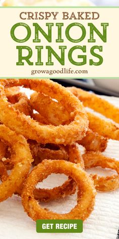 crispy baked onion rings on a white paper towel with text overlay that reads, crispy baked onion rings get recipe