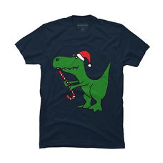 Funny Christmas Green T-rex Dinosaur is a cozy ring spun cotton t-shirt designed by SmileToday for Design By Humans. Pick up this tee and support one of our global artists today. Size: small. Color: navy. Gender: male. Age Group: adult. T Rex Dinosaur, Christmas Green, Sleeve Packaging, Funny Christmas, Black Media, T Rex, Antlers, Christmas Humor, Workout Shorts