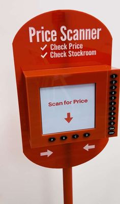 a red sign with an arrow pointing to the price for scanners on it's side