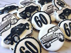 decorated cookies with black and white cars on them