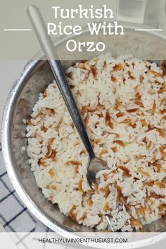 a bowl filled with rice and nuts on top of a table