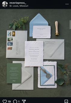 the wedding stationery is laid out on top of each other, including envelopes and cards