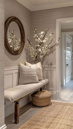 a white bench sitting next to a wooden door in a living room filled with furniture