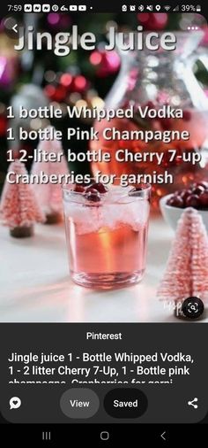 a bottle of pink champagne with cranberries for garnish