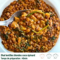 a spoon full of chili and beans in a white bowl with the words, dill lentils blondes coriand tempes de preparation