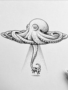 an octopus is floating in the air with its head above it's body and legs