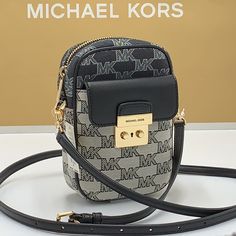 Brand New With Tag Michael Kors Sloan Editor Small Phone Logo Jacquard Crossbody Color: Black Multi Logo Jacquard 78.5% Cotton/21.5% Polyester Trim 1: 60% Polyurethane/20% Cotton/20% Polyester Gold-Tone Hardware 7”H X 4.5”W X 2” D Adjustable Strap: 15.75”-25” Exterior Details: Back Slip Pockets, Front Pocket Interior Details: 3 Cc Slip Pockets Lining: 100% Polyester Imported Michael Kors Black Shoulder Bag With Zipper Closure, Michael Kors Black Shoulder Bag With Zipper, Trendy Michael Kors Black Bag, Michael Kors Trendy Black Shoulder Bag, Trendy Michael Kors Black Shoulder Bag, Trendy Black Michael Kors Shoulder Bag, Small Phone, Phone Logo, Michael Kors Crossbody Bag