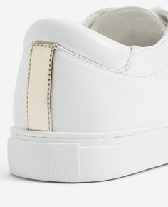 Classic and iconic with distinctive details. Our go-to Kam sneaker is a best-seller for good reason. Details: Women's leather sneaker Round toe Lace-up style Slim profile with a feminine fit Fresh white contrast sole in durable rubber Breathable textile lining Comfortable slight platform sole Iconic gold accent stripe at back | Kenneth Cole | Kam Leather Sneaker in White, Size: 4 White Leather Sneakers With Leather Lining, White Low-top Leather Wedge Sneakers, Mid-top Cream Leather Sneakers, Calf Leather Lace-up Platform Sneakers With White Sole, White Non-slip Leather Sneakers, Womens Group, Travel Essentials For Women, Athleisure Women, Ankle Support