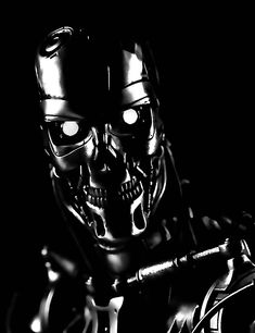 a black and white photo of a robot with glowing eyes, holding a wrench