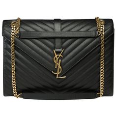 Superb​​ ​​YSL​​ ​​Envelope​​ ​​GM​​ ​​shoulder​​ ​​bag​​ ​​in​​ ​​black​​ ​​grained​​ ​​leather​​ ​​chevron,​​ ​​gold​​ ​​metal​​ ​​trim,​​ ​​metal​​ ​​shoulder​​ ​​strap​​ ​​single​​ ​​or​ ​doubled​ ​allowing​ ​a​ ​shoulder​ ​or​ ​crossbody​ ​wear Magnetic​​ ​​clasp Black​​ ​​canvas​​ ​​lining,​​ ​​1​​ ​​zipped​​ ​​pocket Signature:​​ ​​Saint-Laurent​​ ​​Paris" Dimensions:​​ ​​31x22x5​​ ​​cm​​ ​​(12,2x8,7x2​​ ​​Inches) Single​​ ​​chain​​ ​​length:​​ ​​55​​ ​​cm​​​​ ​​​​(21,6​​​​ ​​​​Inches) Do Ysl Envelope Bag Black, Envelope Bag Ysl, Ysl Envelope, Gucci Soho Bag, Red Quilts, Black Chevron, Saint Laurent Paris, Metal Trim, Handbag Straps