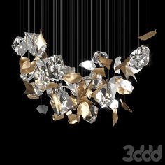 a bunch of diamonds that are hanging from the ceiling in front of a black background