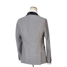 Package Includes: 1 x Jacket - 1 x Waistcoat - 1 x Pant

Experience sophistication with our grey tuxedo, tailored from fine 120s fabric with silk lining and half canvas construction. It showcases a plain pattern, complemented by black velvet buttons, a shawl lapel, and a U-shape double-breasted waistcoat, making it an impeccable choice for all seasons.

 	Fabric: 120s 
 	Lining Fabric: Silk
 	Pattern: Plain
 	Buttons: Black Velvet Fabric
 	Construction: Half Canvas
 	Seasonality: All Season
 	Ja Tuxedo Three-piece Suit With Lapel Collar, Formal Gray Sport Coat With Suit Collar, Gray Sport Coat With Suit Collar For Formal Occasions, Tailored Blazer For Black Tie Winter Events, Tailored Winter Blazer For Black Tie Events, Tailored Gray Blazer, Gray Notch Lapel Sport Coat For Formal Occasions, Tuxedo Three-piece Suit With Pressed Crease And Lapel Collar, Tuxedo Three-piece Suit With Pressed Crease